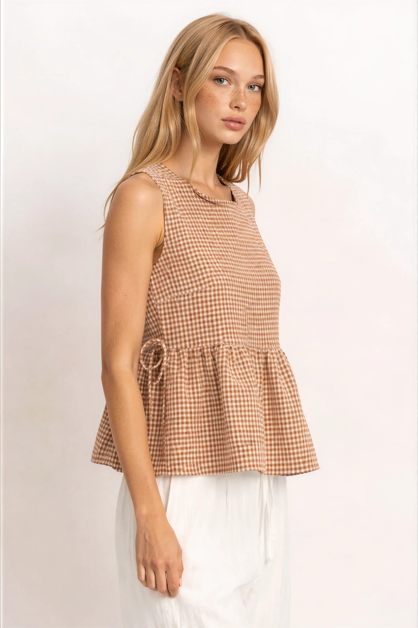Kailee Gingham Sleeveless Peplum Top in Brown – FEHRNVI Kailee Gingham Sleeveless Peplum Top in Brown – FEHRNVI