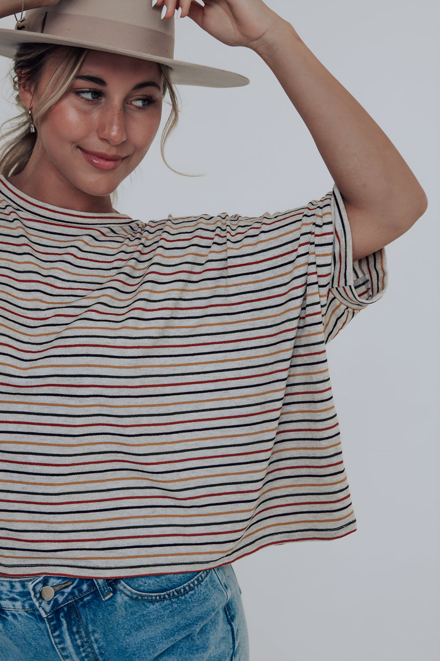 Orange, red, blue, and yellow striped oversized top
