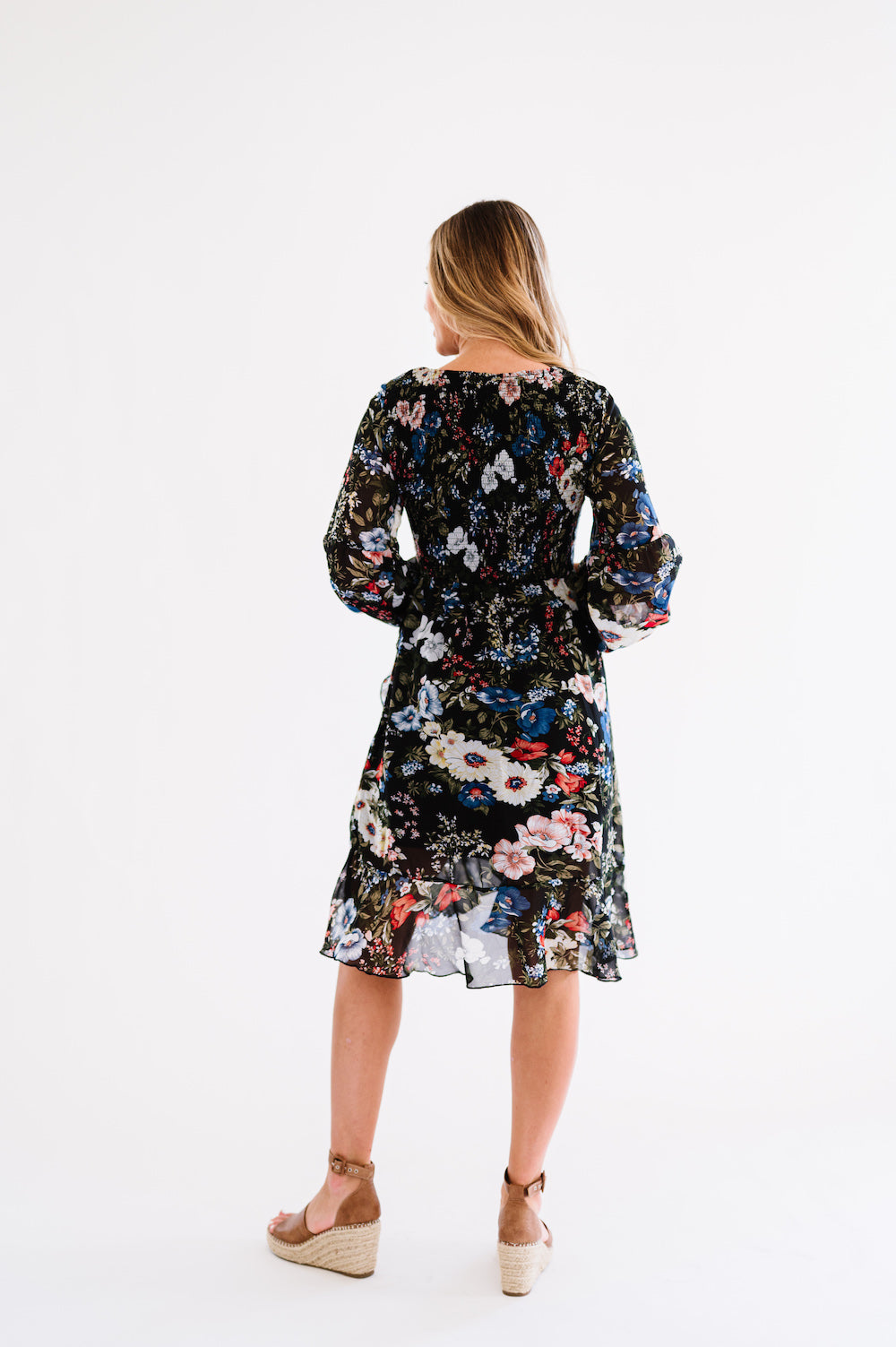 Black knee length dress with floral print