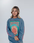 Oversized blue graphic tee with sun detail