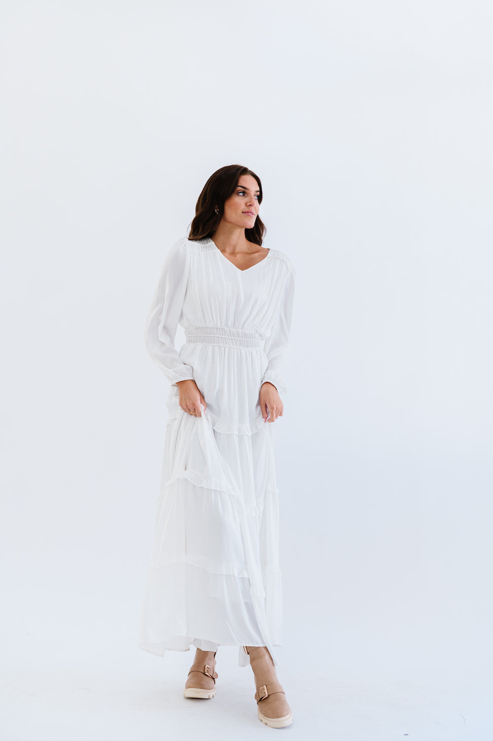 White floor length dress with long sleeves
