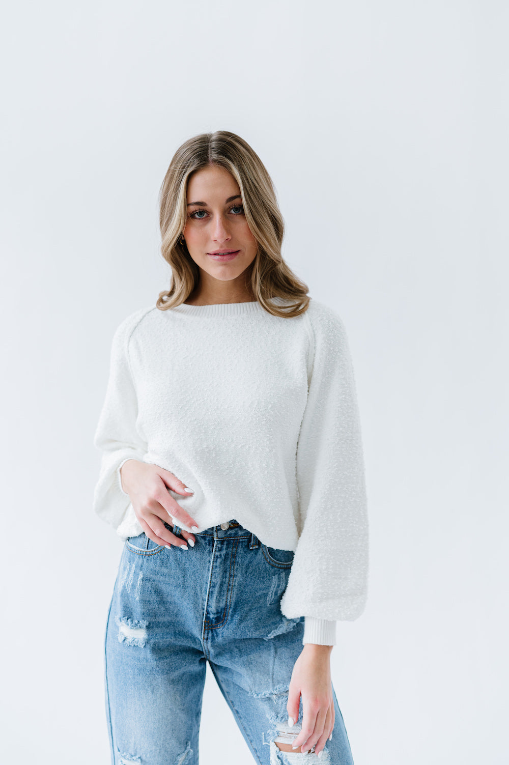 White sweater with long billowy sleeves