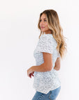 White peplum top with short sleeves